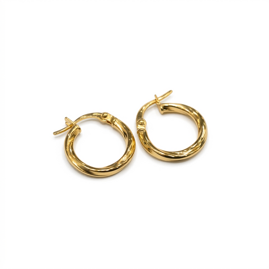 Pair of gold hoop earrings on a white background