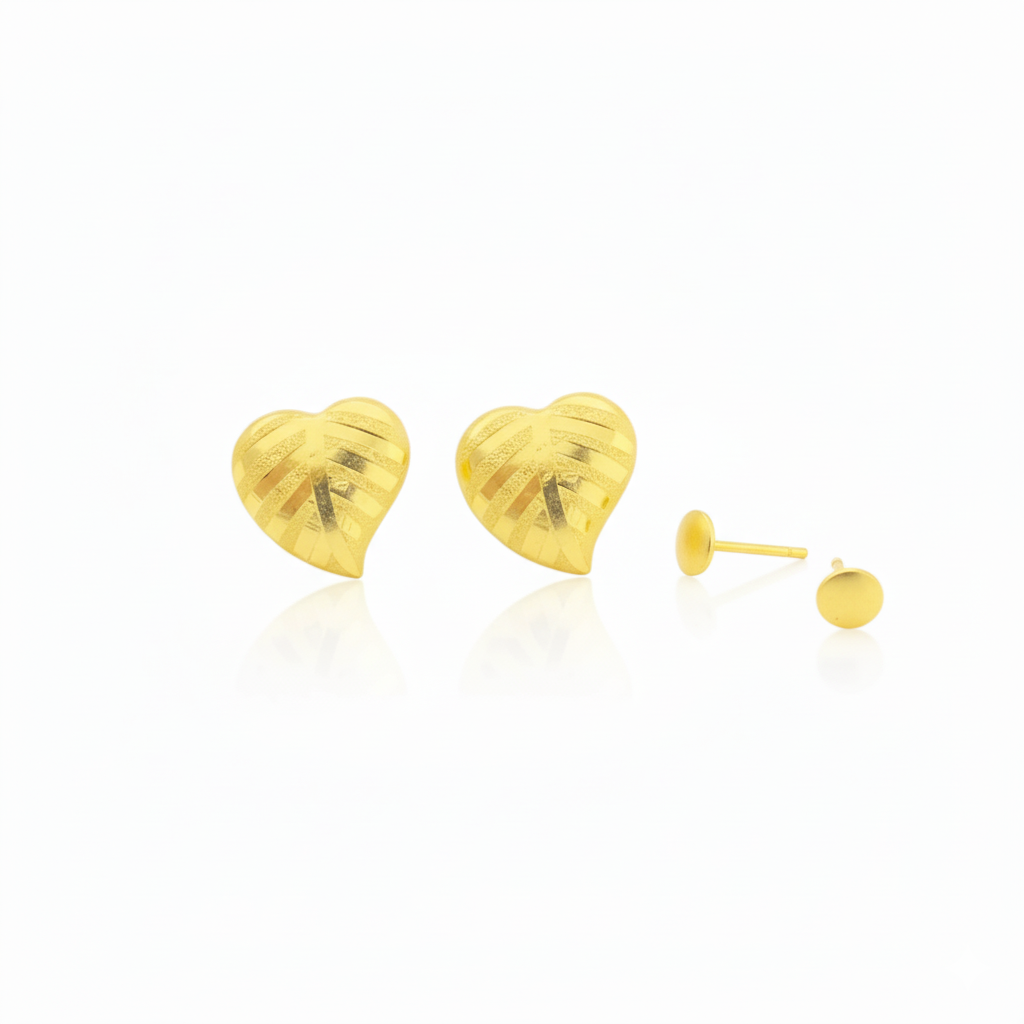 Pair of heart-shaped gold stud earrings with textured design on white background