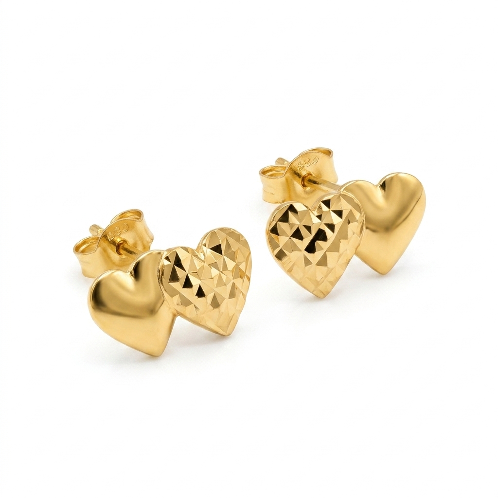 Gold heart-shaped earrings on a white background