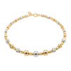 Bracelet with gold and silver beads on a white background