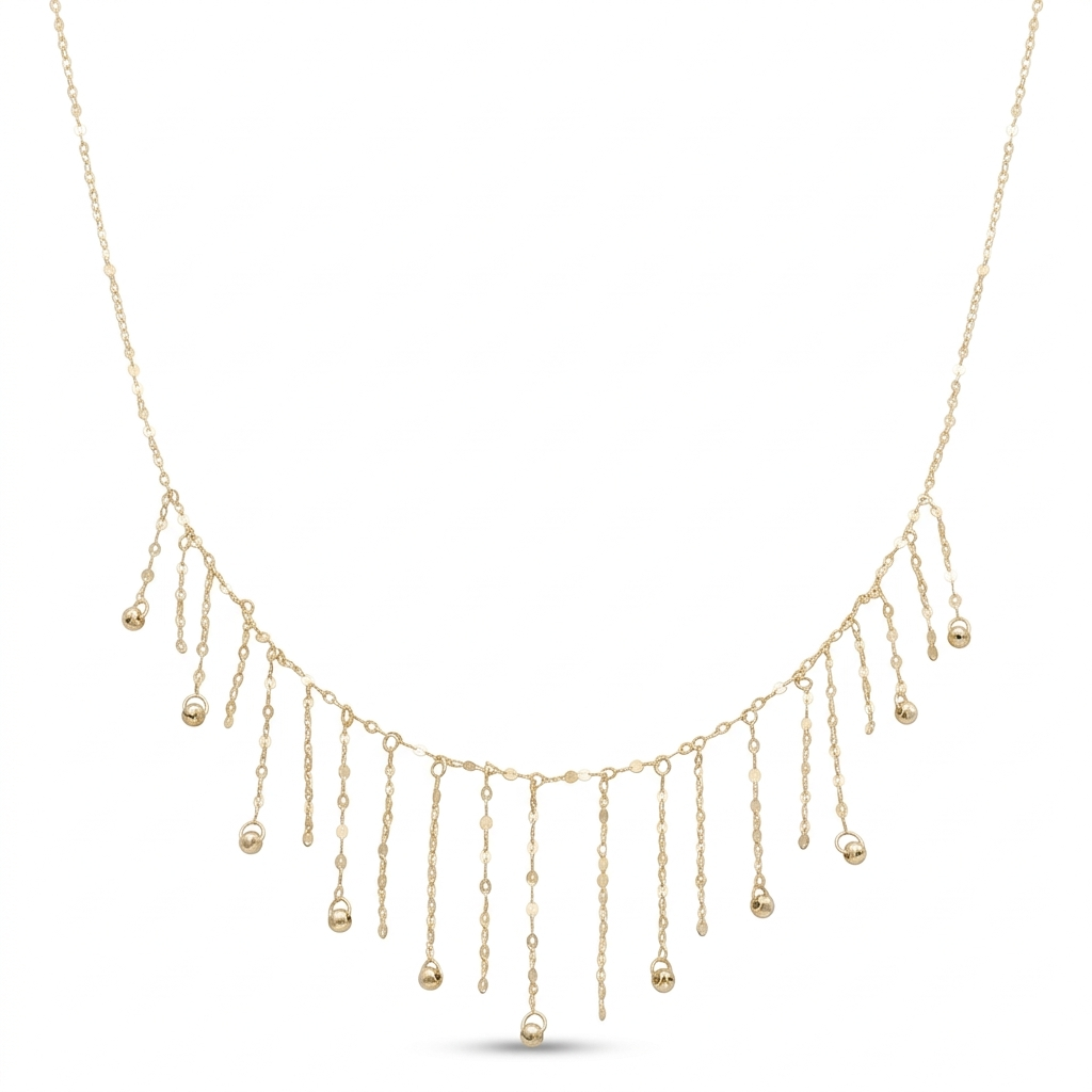 Gold necklace with dangling beads on a white background