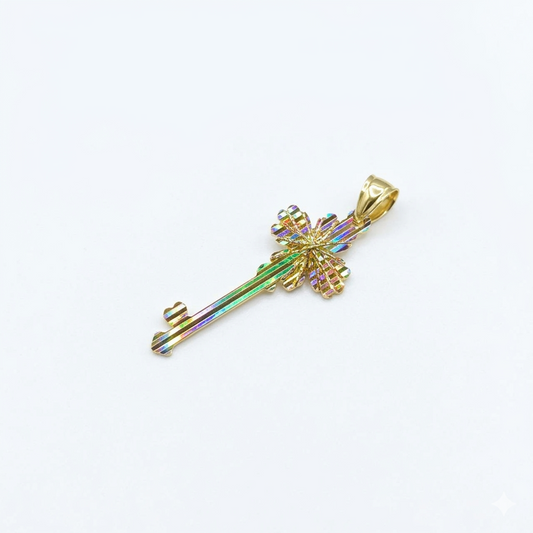 Gold key-shaped pendant with a colorful gemstone on a white background