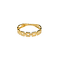Gold ring with geometric design on a white background