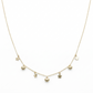 Gold necklace with heart and star pendants on a white background
