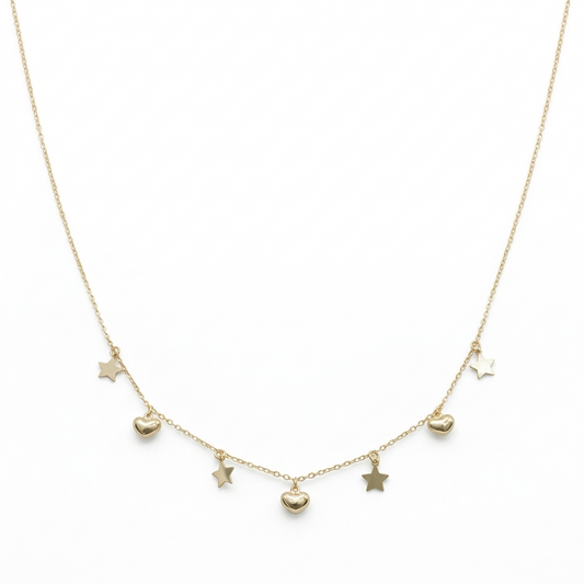 Gold necklace with heart and star pendants on a white background