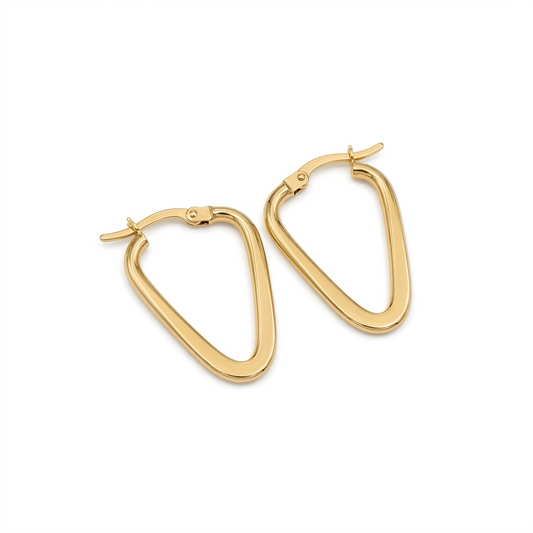 Gold hoop earrings on a white background
