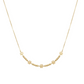 Gold necklace with small floral and round beads on a white background