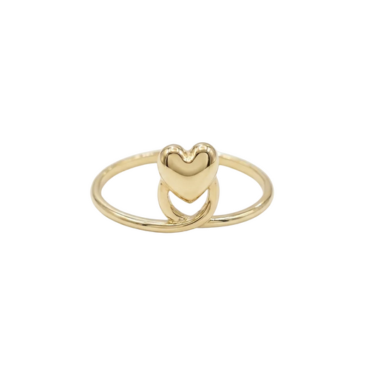 Gold heart-shaped ring on a white background
