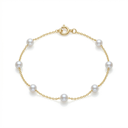 Gold bracelet with pearls on a white background