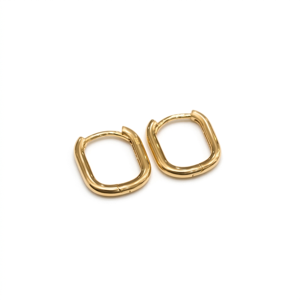 Gold hoop earrings on a white background