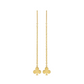 Gold clover-shaped earrings on thin chains against a white background