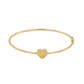 Gold bangle with a heart charm on a white background