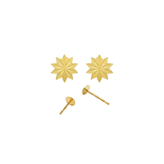 Gold star-shaped earrings on a white background