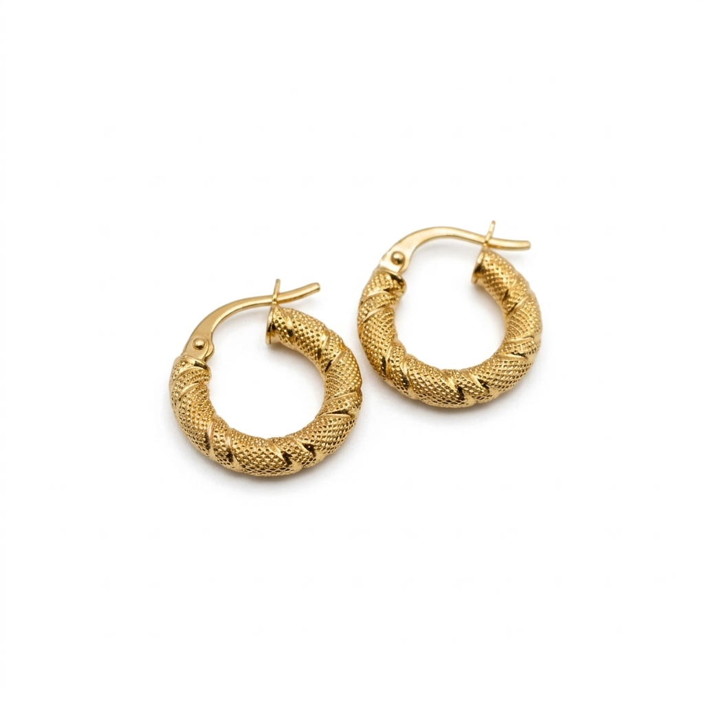 Gold hoop earrings with textured design on a white background
