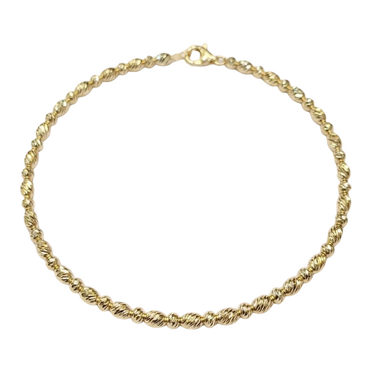 Gold chain bracelet on a white background