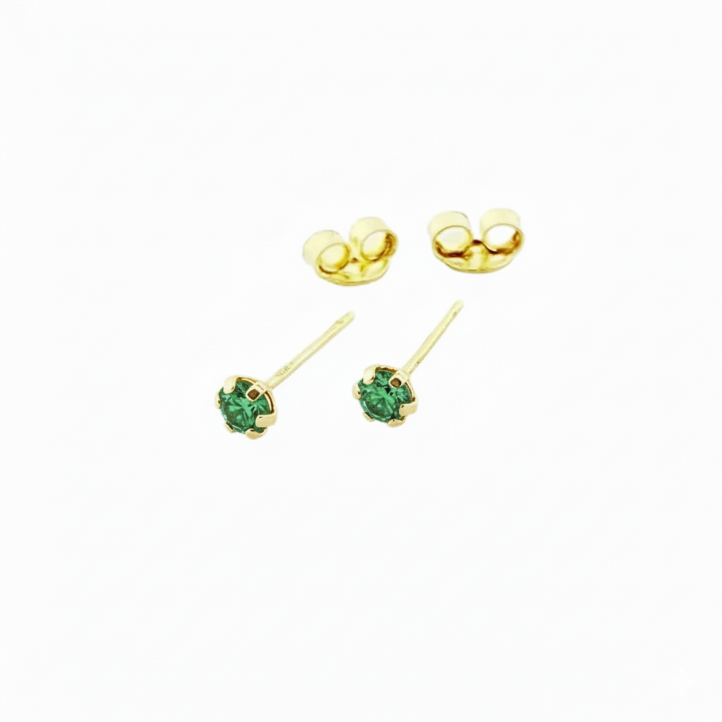 Gold stud earrings with green gemstone on white background
