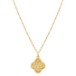 Gold necklace with a clover-shaped pendant on a white background