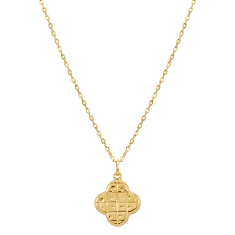 Gold necklace with a clover-shaped pendant on a white background