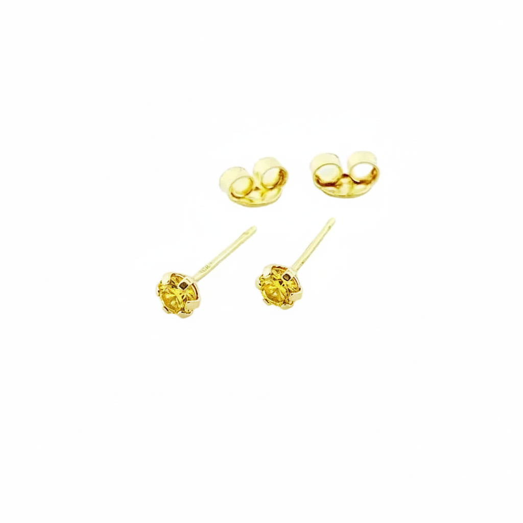 Pair of gold stud earrings with butterfly backs on white background