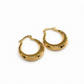 Gold hoop earrings on a white background