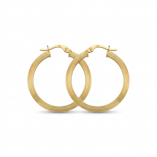 Gold hoop earrings on a white background