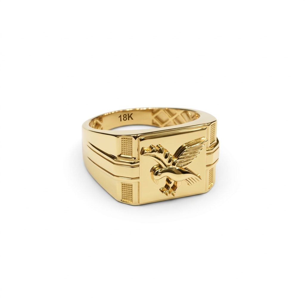 Gold ring with eagle emblem on a white background