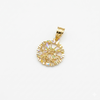 Gold pendant with a clear gemstone on a white background