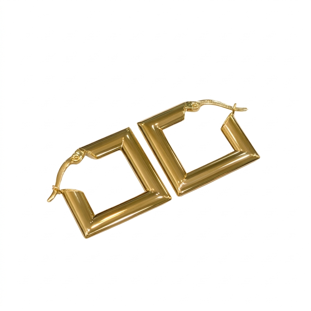 Gold hoop earrings on a white background