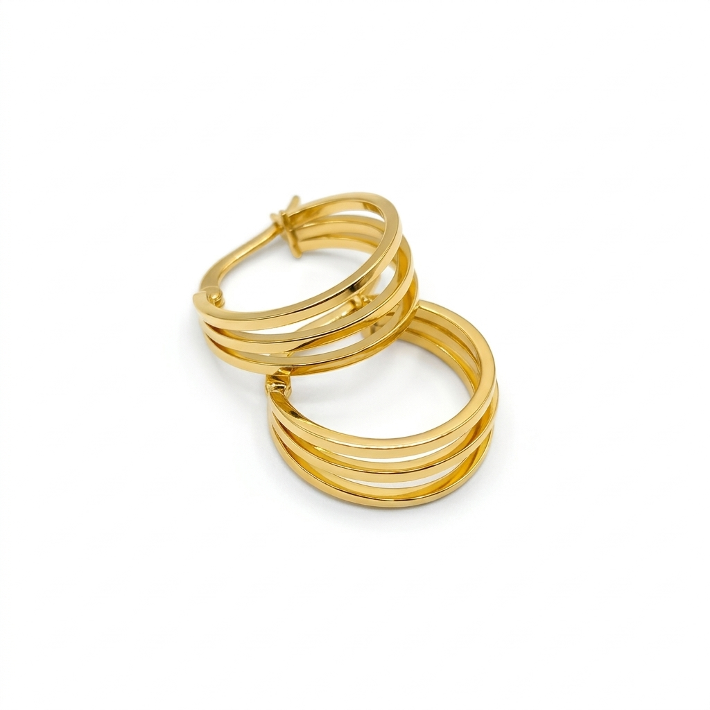 Gold hoop earrings on a white background