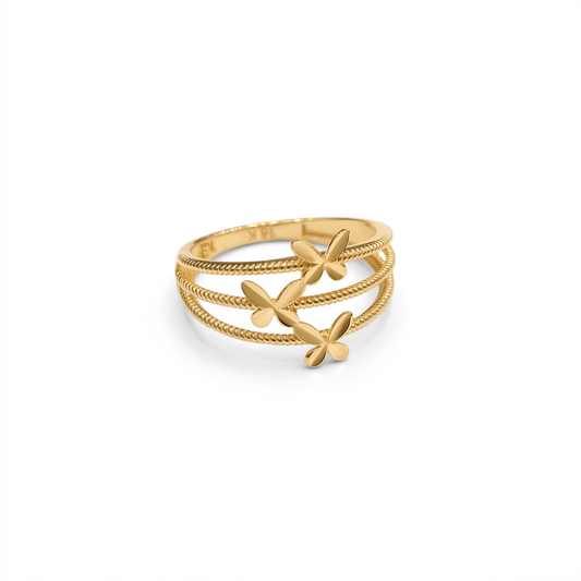 Gold ring with floral designs on a white background