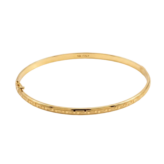 Gold bracelet with intricate design on a white background