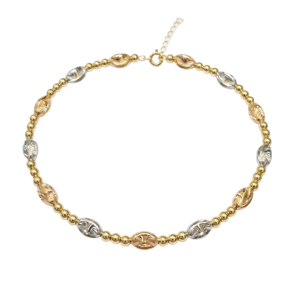 Gold and silver beaded necklace on a white background