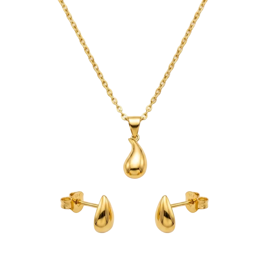 Gold necklace and earrings set on a white background