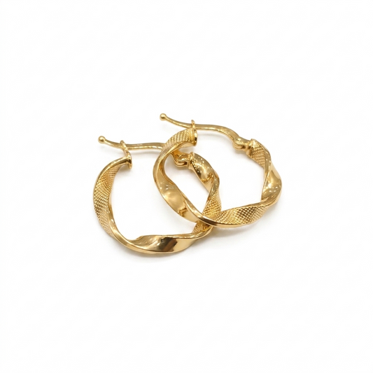Gold hoop earrings on a white background