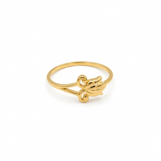 Gold ring with a unique design on a white background