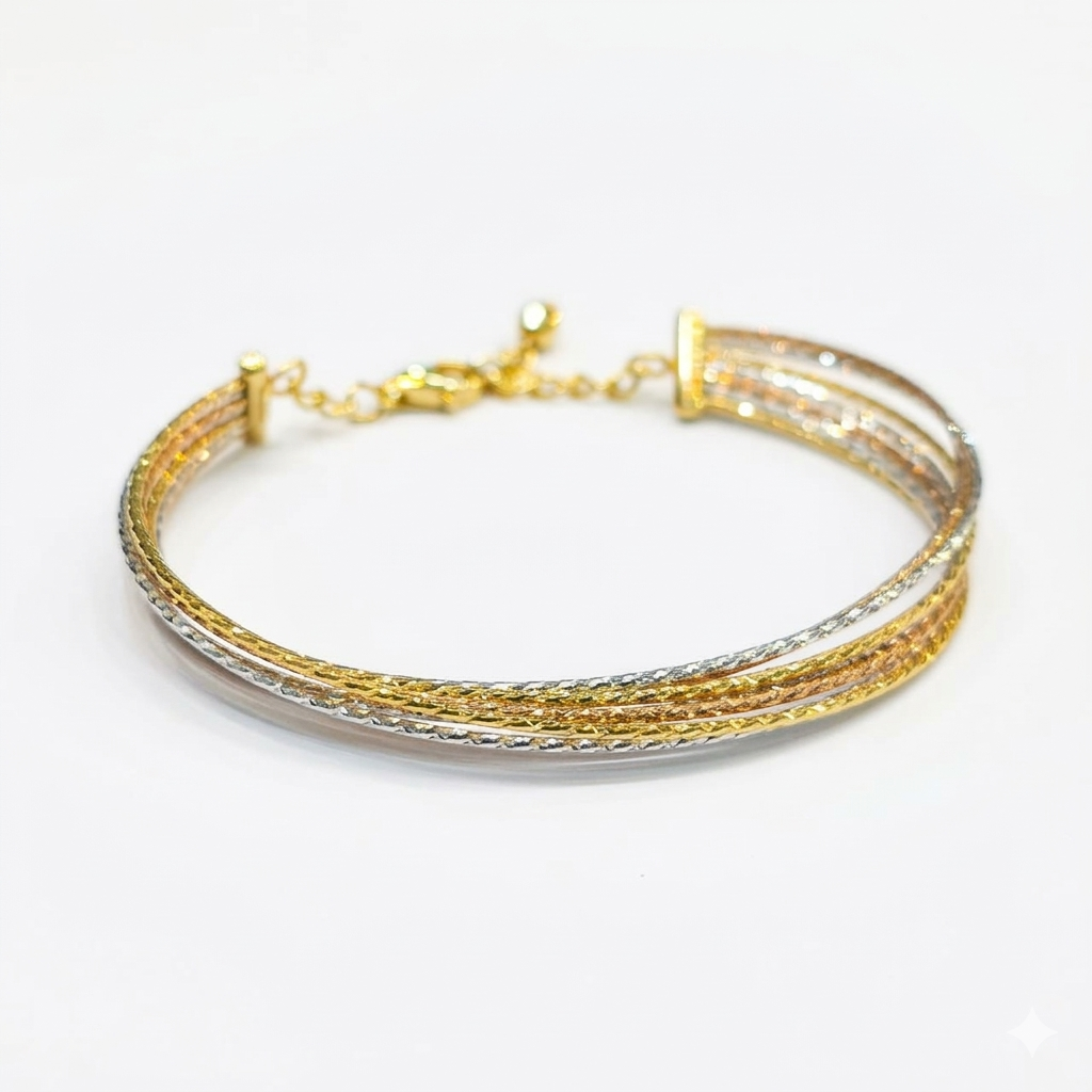 Gold and silver bracelet on a white background