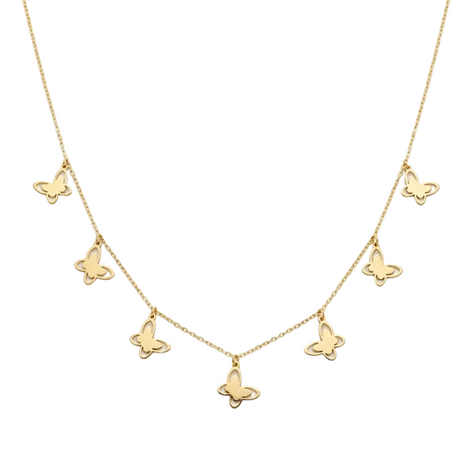 Gold butterfly necklace on a white background