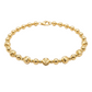 Gold beaded bracelet on a white background