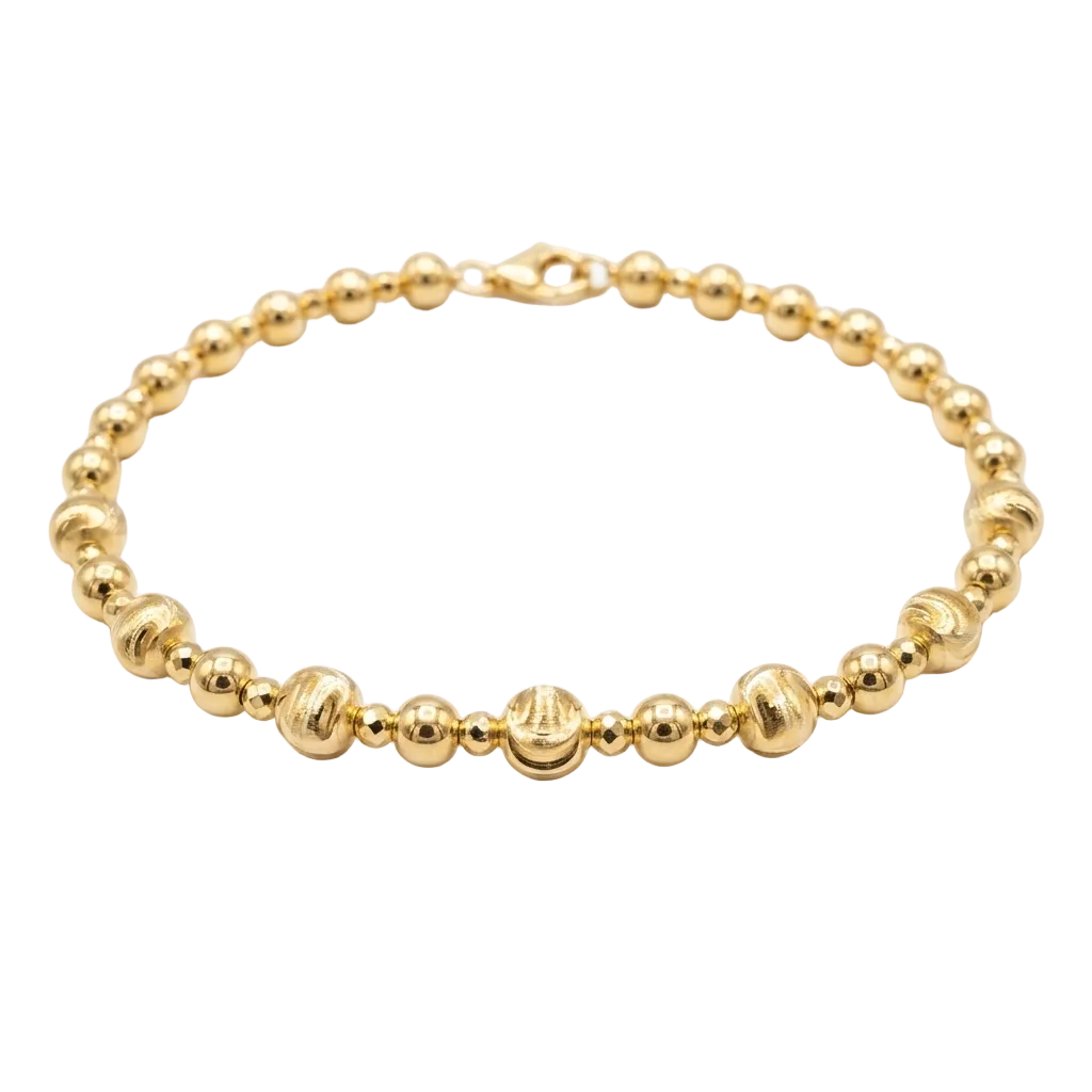 Gold beaded bracelet on a white background