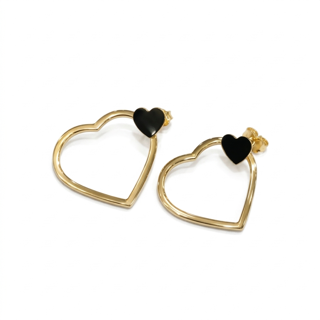 Heart-shaped earrings with black centers on a white background
