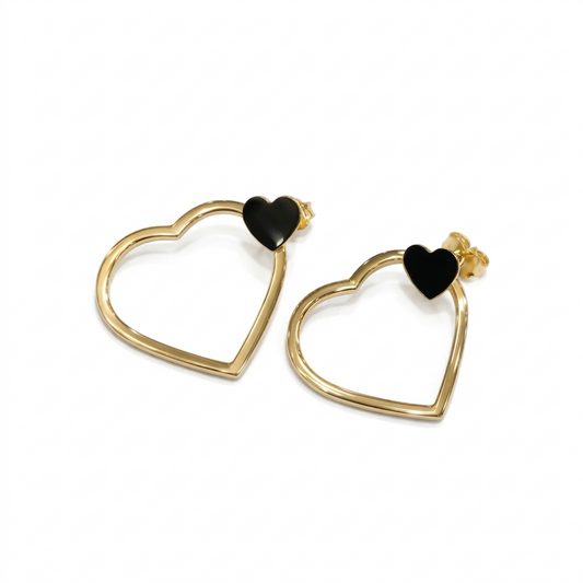 Heart-shaped earrings with black centers on a white background