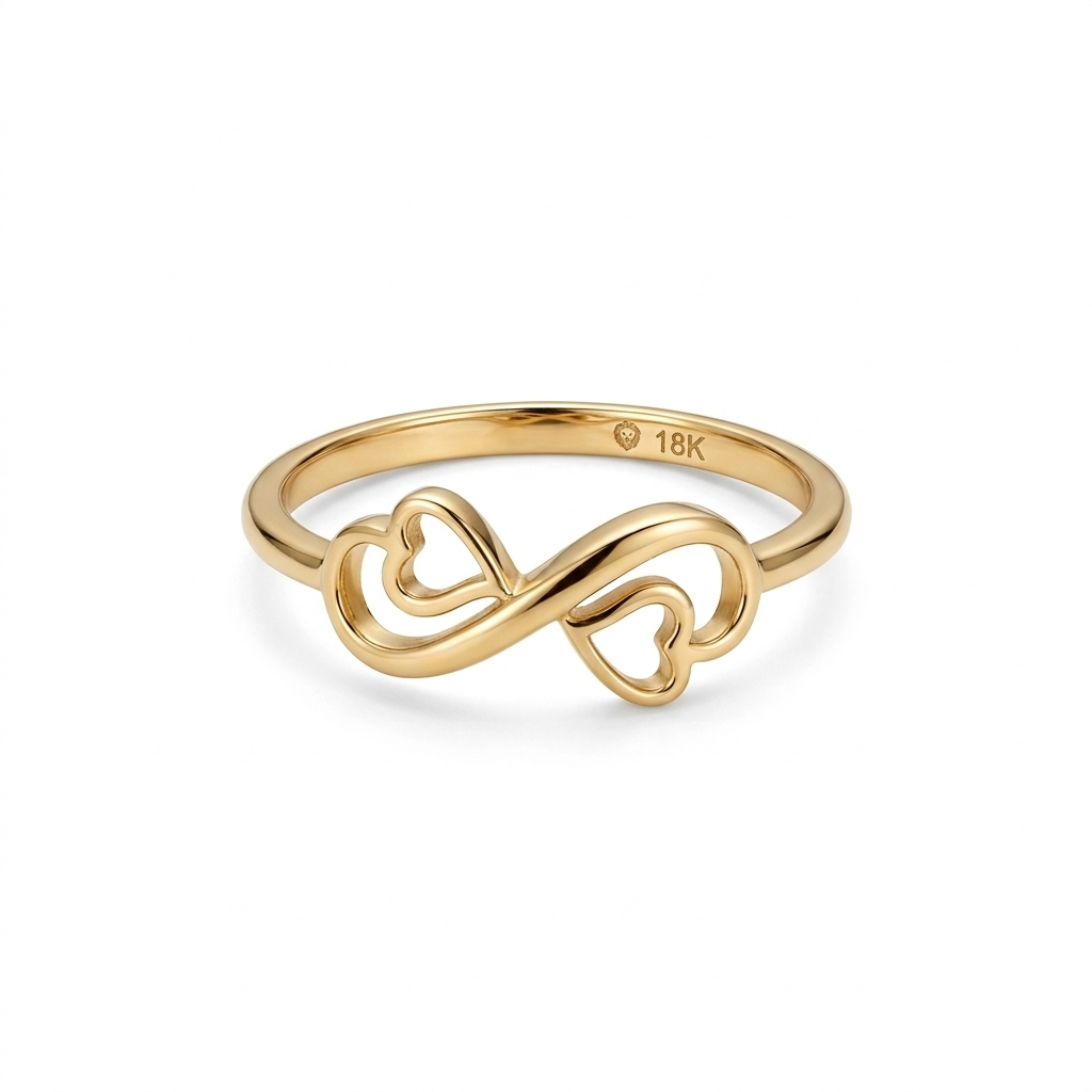 Gold ring with heart and infinity design on a white background