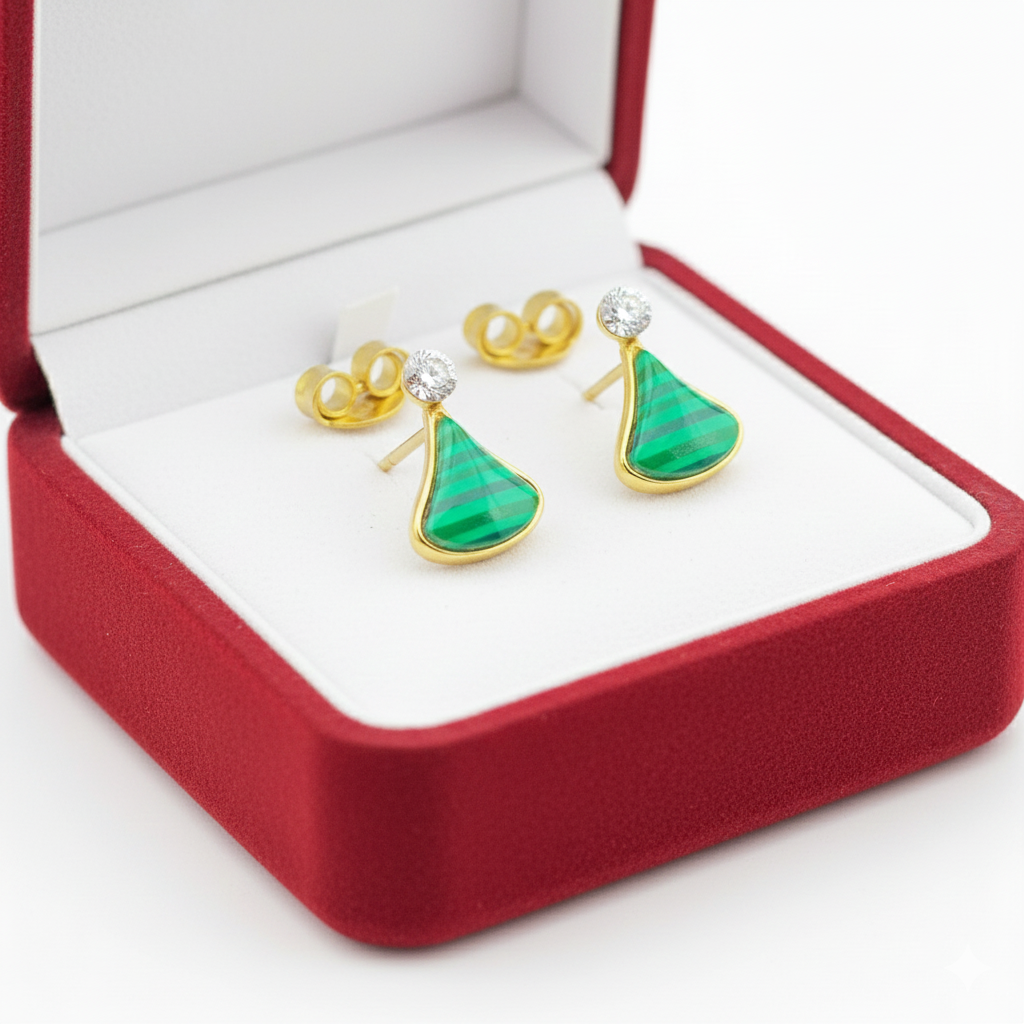 Gold stud earrings with green gemstone and diamond accent in red jewelry box