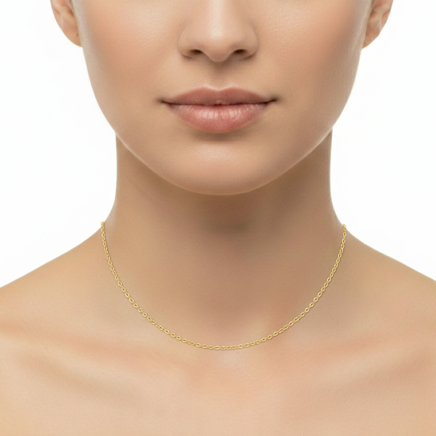 Gold necklace on a model against a white background