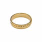 Gold ring with textured design on a white background