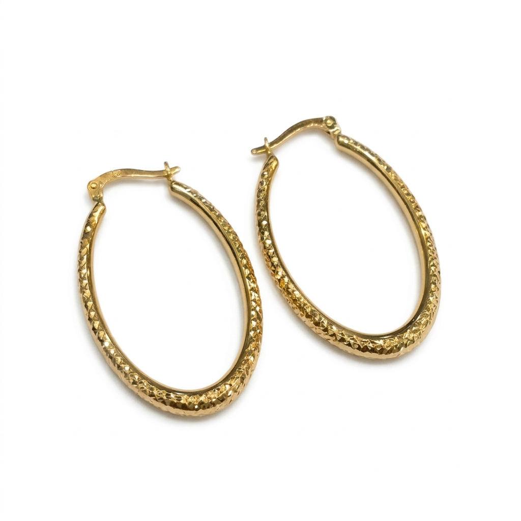 Gold hoop earrings on a white background