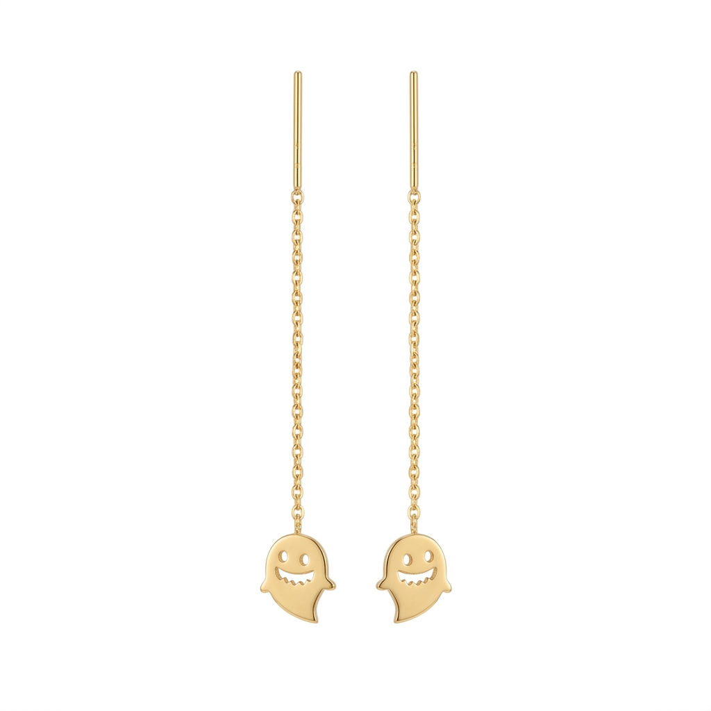 Gold ghost-shaped earrings on a white background