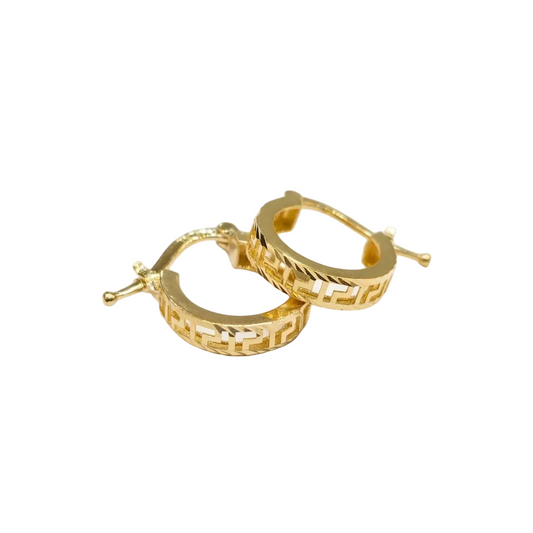 Pair of gold hoop earrings on a white background