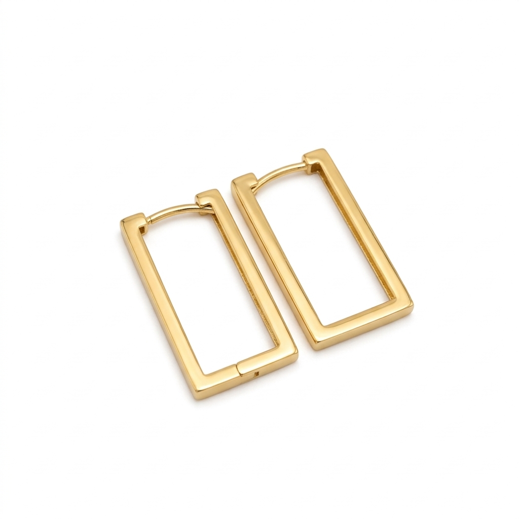 Pair of gold hoop earrings on a white background