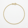 Gold bracelet on a white background